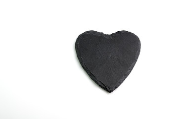 hand crafted heart shaped Welsh slate drinks coaster isolated on white background