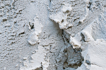 Fragment of fresh plaster on the wall of the house