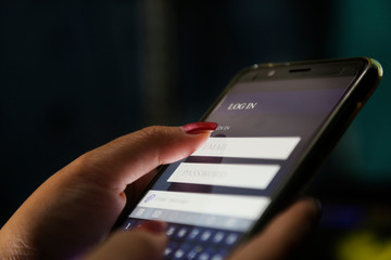 hands showing profit graph on a smart phone