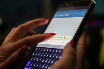 hands showing profit graph on a smart phone