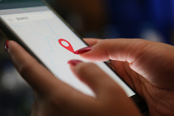 hands showing profit graph on a smart phone