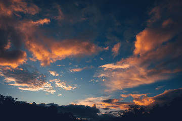Evening sky, orange clouds and blue sky
