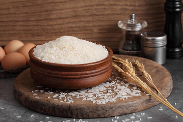 thai white jasmine rice in wooden bowl in kitchen with a blank space for a text, thai agriculture concept