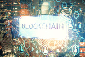 Multi exposure of cryptocurrency theme hologram drawing and city veiw background. Concept of...