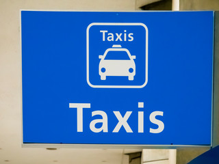Blue taxi sign board at Paris airport