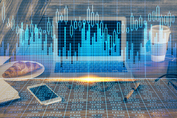 Double exposure of forex graph and work space with computer. Concept of international online trading.