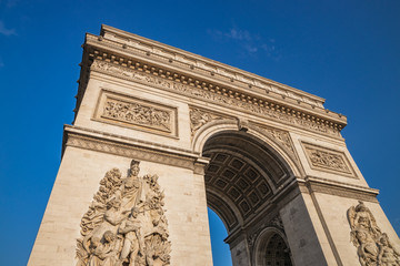 Low angle shot the Arc de Triomphe, Paris France, at the center of Place Charles de Gaulle,...