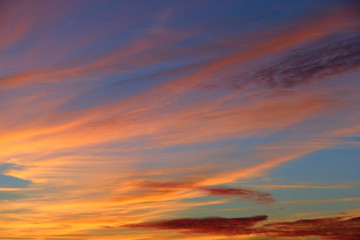 Orange sunset before night. Twilight with bright sunset. Evening landscape