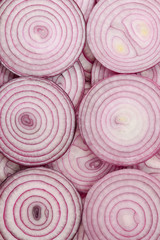 Onion slices as a background. Top view.