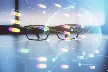 Map hologram with glasses on the table background. Concept of globalization. Double exposure.