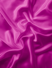 Beautiful smooth elegant wavy hot pink satin silk luxury cloth fabric texture, abstract background design. 