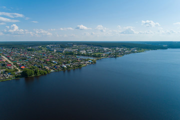 Obraz premium Rezh city and pond. Russia, Sverdlovsk region. Summer, sunny. Aerial