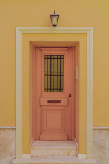 door in yellow wall