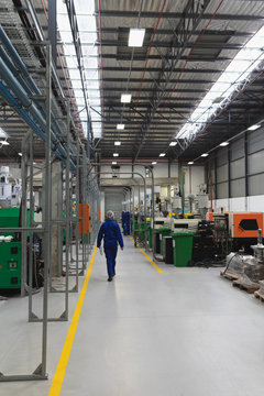 Factory worker in a factory warehouse building