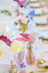 Elegant dinner table set with silverware, napkin and glass at restaurant before party