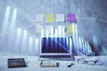 Double exposure of forex graph and work space with computer. Concept of international online trading.