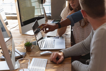Young creative professionals working in an office