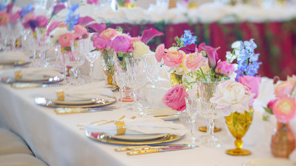 Fototapeta premium Elegant dinner table set with silverware, napkin and glass at restaurant before party