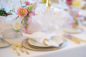 Fototapeta na wymiar Elegant dinner table set with silverware, napkin and glass at restaurant before party