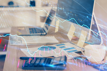 Double exposure of graph and financial info and work space with computer background. Concept of...