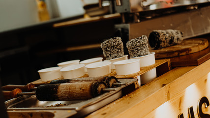 Cooking of trdelniks on the grill at the point of sale.
