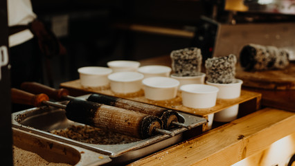 Cooking of trdelniks on the grill at the point of sale.