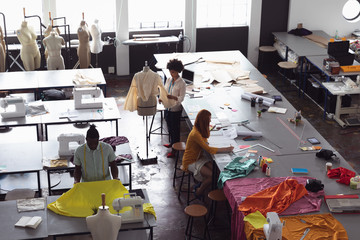 Young students working on projects at a fashion college