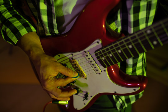 Guitarist playing in a sound studio