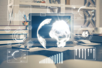 Financial graph colorful drawing and table with computer on background. Double exposure. Concept of international markets.