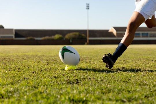 Young adult female rugby player on a rugby pitch