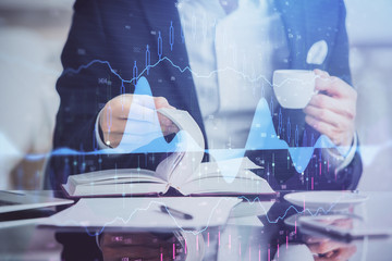 Double exposure of businessman with coffee with stock market forex chart.