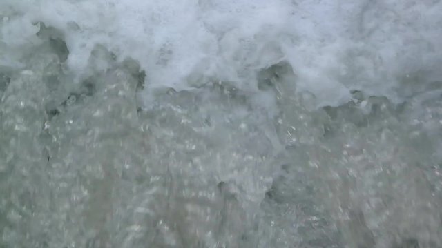 river currents under the bridge during the day