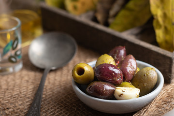 Black and green olives in a small bowl 