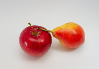  red apple and pear on a white background