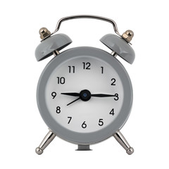 A gray clock with an alarm clock on a white background with arrows showing the time nine hours...