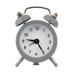 A gray clock with an alarm clock on a white background with arrows showing the time nine hours twenty five minutes or twenty one hours twenty five minutes
