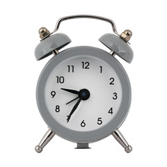 A gray clock with an alarm clock on a white background with arrows showing the time nine hours thirty five minutes or twenty one hours thirty five minutes