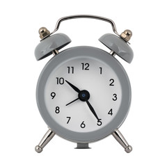 A gray clock with an alarm clock on a white background with arrows showing the time ten hours twenty five minutes or twenty two hours twenty five minutes