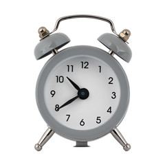A gray clock with an alarm clock on a white background with arrows showing the time ten hours forty minutes or twenty two hours forty minutes
