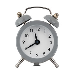 A gray clock with an alarm clock on a white background with arrows showing the time eleven hours forty minutes or twenty three hours forty minutes