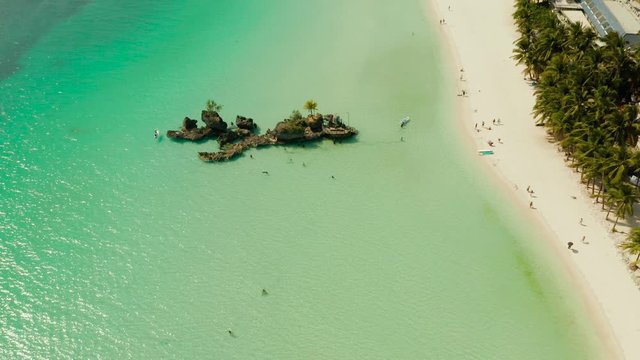 White sand beach and lagoon with turquoise water, aerial view. Coast of the island of Boracay, Philippines. Boracay island Grotto, Willy's Rock.
