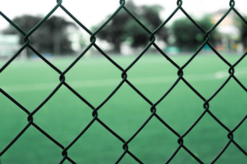 Fototapeta premium The fence on the inside has a lawn.