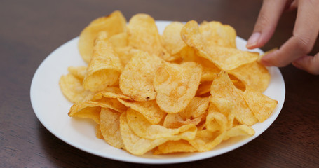 Potato chip on white plate
