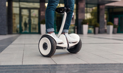 Crop guy riding self balancing scooter