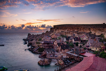 Sunset over the Popeye Village near Mellieha in Malta