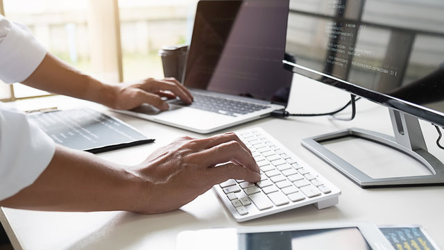 Programmer working in a software development and coding technologies. Website design. Technology concept.