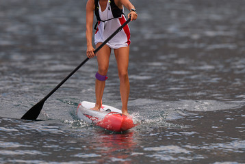 Stand up paddle board woman paddle boarding on ocean
