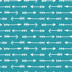 Vector seamless arrow pattern in blue. Simple doodle arrows drawings made into repeat. Great for background, wallpaper, wrapping paper, packaging, fashion.