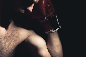 boxer with gloves on a dark background