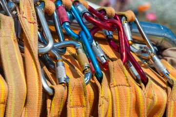 Colorful carbines on the safety ropes. Close-up. Selective focus.